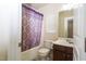 Bathroom featuring a tub, shower, toilet, vanity, and mirror with lighting at 1017 Frank Page Dr, Cary, NC 27511