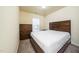 Neutral bedroom with wooden furniture and a window providing natural light at 1017 Frank Page Dr, Cary, NC 27511