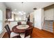 Dining room featuring a round table, hardwood floors, and a chandelier at 1017 Frank Page Dr, Cary, NC 27511
