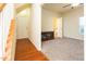 Inviting living room showcasing neutral carpet, adjacent bathroom, and staircase for comfortable everyday living at 1017 Frank Page Dr, Cary, NC 27511