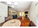 Inviting living room with a cozy fireplace, hardwood floors, and natural light at 1017 Frank Page Dr, Cary, NC 27511