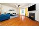 Bright living room with hardwood floors, a fireplace, and modern decor at 1017 Frank Page Dr, Cary, NC 27511