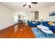 Spacious living area with hardwood floors, modern furniture, and seamless flow to kitchen at 1017 Frank Page Dr, Cary, NC 27511