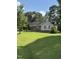 Charming single-story home with a covered front porch and lush green lawn at 104 Holly Ranch Ct, Willow Springs, NC 27592