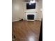 Cozy living room with hardwood floors, fireplace and mounted television at 104 Holly Ranch Ct, Willow Springs, NC 27592