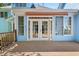 Covered back porch featuring white french doors and lots of natural light. Perfect for outdoor relaxation at 104 Shady Ridge Ct, Apex, NC 27502