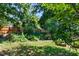 Green backyard featuring raised garden beds for cultivating your own produce at 104 Shady Ridge Ct, Apex, NC 27502
