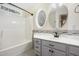 Bathroom with tub and decorative window above vanity, offering a relaxing and bright space at 104 Shady Ridge Ct, Apex, NC 27502