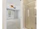 Bathroom access in bedroom with sliding door, view of bedroom and shower at 104 Shady Ridge Ct, Apex, NC 27502
