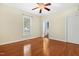 Bedroom featuring hardwood floors, closet, and natural light at 104 Shady Ridge Ct, Apex, NC 27502