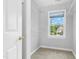 Organized walk-in closet with shelving and window, providing ample storage and natural light at 104 Shady Ridge Ct, Apex, NC 27502