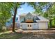 Charming light blue two-story home featuring a garage and back deck overlooking the yard at 104 Shady Ridge Ct, Apex, NC 27502