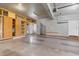 Spacious garage with built-in wood cabinets, sink and a door to outside at 104 Shady Ridge Ct, Apex, NC 27502