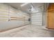 View of a garage featuring a garage door and built-in storage at 104 Shady Ridge Ct, Apex, NC 27502