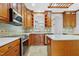 Charming kitchen with granite counters, stainless appliances, custom cabinets, and a seamless open layout at 104 Shady Ridge Ct, Apex, NC 27502