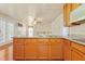 Well-designed kitchen with ample wood cabinetry and views extending to the living areas at 104 Shady Ridge Ct, Apex, NC 27502
