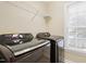 Modern laundry room with Samsung washer and dryer and wire rack shelf for efficient storage at 104 Shady Ridge Ct, Apex, NC 27502