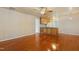 Open-concept living area with hardwood floors, connecting seamlessly to the adjacent kitchen at 104 Shady Ridge Ct, Apex, NC 27502