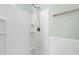 All-white tiled shower with shelves and sleek fixtures at 104 Shady Ridge Ct, Apex, NC 27502