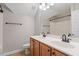 Functional bathroom with double sinks, oak cabinetry, and a shower/tub combination, perfect for everyday use at 104 Trinity Grove Dr, Cary, NC 27513