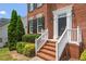 Close-up of the brick entryway with a freshly painted door and decorative trim at 104 Trinity Grove Dr, Cary, NC 27513