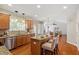 Open kitchen with granite countertops, stainless appliances, and breakfast bar at 104 Trinity Grove Dr, Cary, NC 27513