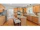 Well-equipped kitchen with hardwood floors, granite countertops, and island at 104 Trinity Grove Dr, Cary, NC 27513