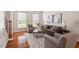 Cozy living room featuring hardwood floors and comfortable seating area at 104 Trinity Grove Dr, Cary, NC 27513