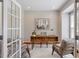 Stylish office with hardwood floors, french doors, and modern furnishings at 104 Trinity Grove Dr, Cary, NC 27513