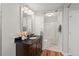 Bathroom featuring dark vanity, granite countertop, and a shower/tub combo at 106 Choptank Ct # B-2, Cary, NC 27513
