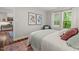 Bedroom with a large window and modern decor offers a relaxing retreat at 106 Choptank Ct # B-2, Cary, NC 27513