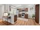 Modern kitchen features stainless steel appliances, dark wood cabinets, and stylish flooring at 106 Choptank Ct # B-2, Cary, NC 27513