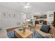 Open-concept living space features hardwood floors, modern decor, and kitchen access at 106 Choptank Ct # B-2, Cary, NC 27513