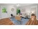 Cozy living room with stylish furnishings, ceiling fan, and access to outdoor patio at 106 Choptank Ct # B-2, Cary, NC 27513