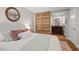 Serene bedroom with wood sliding doors leading to the bathroom at 106 Choptank Ct # B-2, Cary, NC 27513