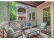 Screened porch featuring outdoor seating, a view of the property, and concrete floors at 106 Choptank Ct # B-2, Cary, NC 27513