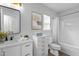 Clean bathroom featuring modern fixtures, a vanity with storage, and a shower-tub combination at 1104 Pebblestone Drive, Durham, NC 27703