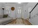 Inviting foyer with wood floors, a staircase, and a front door with decorative glass at 1104 Pebblestone Drive, Durham, NC 27703