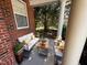 Cozy front porch furnished with a comfortable seating area, perfect for enjoying the outdoors at 1104 Pebblestone Drive, Durham, NC 27703