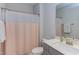 Bathroom with a shower-tub combination, vanity, and neutral decor at 112 Bellmont Crest Dr, Holly Springs, NC 27540