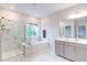 Bathroom features marble tile floors, a shower, a soaking tub and a vanity with drawers at 112 Bellmont Crest Dr, Holly Springs, NC 27540
