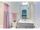 Bathroom with vanity, toilet, and pink shower curtain at 112 Bellmont Crest Dr, Holly Springs, NC 27540