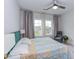 Bedroom with a large window and a sitting area at 112 Bellmont Crest Dr, Holly Springs, NC 27540