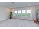 Spacious bonus room with large windows and bright natural light at 112 Bellmont Crest Dr, Holly Springs, NC 27540
