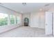 Bonus room featuring neutral walls, carpet, windows, and an accent chair at 112 Bellmont Crest Dr, Holly Springs, NC 27540