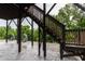 Covered deck with hanging egg chairs below providing a relaxing shaded outdoor space at 112 Bellmont Crest Dr, Holly Springs, NC 27540