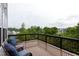 Cozy covered deck with chairs to enjoy the outside landscape views at 112 Bellmont Crest Dr, Holly Springs, NC 27540
