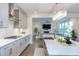 Well-appointed kitchen with island, stainless steel appliances, and an open-concept design at 112 Bellmont Crest Dr, Holly Springs, NC 27540