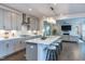 Open kitchen layout with a large island, stainless steel appliances, and a view to the living room at 112 Bellmont Crest Dr, Holly Springs, NC 27540