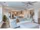 Open-concept living room featuring hardwood floors, neutral tones, and seamless flow to the modern kitchen at 112 Bellmont Crest Dr, Holly Springs, NC 27540